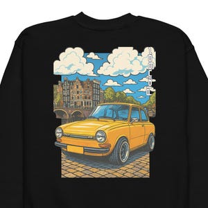 May include: Black sweatshirt featuring a graphic of a yellow vintage car in front of a European cityscape with a bridge and buildings. The sky is blue with white clouds. The word "Dafingor" is printed vertically on the right.