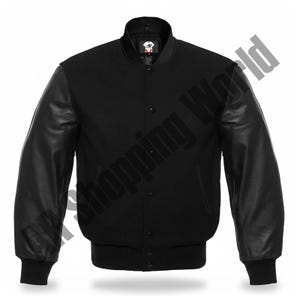 May include: A black varsity jacket with black leather sleeves. The jacket has a ribbed collar, cuffs, and hem. It features a button-up front and a small logo patch on the chest. The jacket is a classic style.