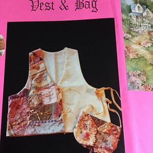 May include: A quilted vest and matching bag with a patchwork design in shades of pink, brown, and white. The vest has a white lining and ties at the neck. The bag has a tassel.