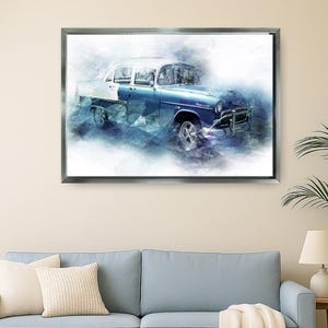 May include: Framed watercolour print of a classic blue and white vintage car. The artwork features a detailed depiction of the vehicle, with a focus on its body and wheels. The car is set against a soft, abstract background.