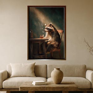 May include: A framed artwork shows a raccoon smoking a cigarette and drinking at a small wooden table. The raccoon is seated in a wooden chair. A bottle is on the table. The background is dark green with a beam of light.