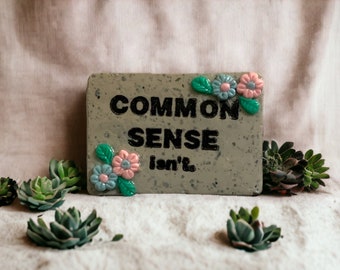 Common sense isn't..funny...faux granite clay magnet 1 1/2 x 1.. gift favors