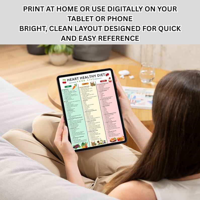 May include: A tablet displaying a colorful "Heart Healthy Diet" food list. The screen shows a bright, clean layout with sections for vegetables, grains, and fruits. Text at the top reads: "Print at home or use digitally on your tablet or phone."
