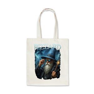 May include: Cream tote bag with a wizard illustration. The wizard is depicted wearing a blue hat and sunglasses, holding a staff. The word "RIZZARD" is printed above the wizard in a light blue font. A dragon and lightning are in the background.
