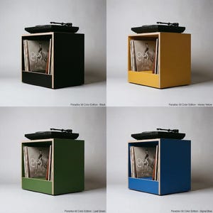 Paradiso 50 Color Edition modular plywood record player stand with natural plywood edges is shown in a four panel grid against a gray background with four color options. Each unit has a black turntable on top and upright vinyl storage below. The colorways are labeled Black, Honey Yellow, Leaf Green, and Signal Blue.