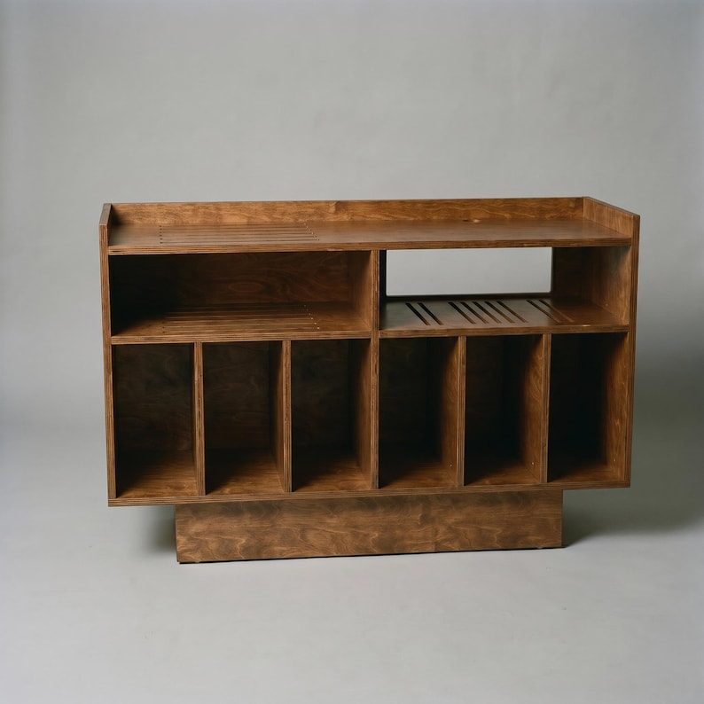 Walnut record player stand with open turntable shelf, receiver space, cable management, ventilation slots, and six vinyl storage compartments for home audio organization.