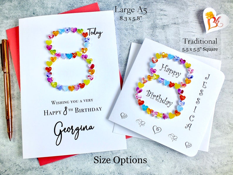 May include: A white card with a colorful number eight made of hearts. The card says "Wishing you a very happy 8th birthday Georgina" and "Today". The card is available in two sizes: Large A5 (8.3 x 5.8 inches) and Traditional (5.5 x 5.5 inches).