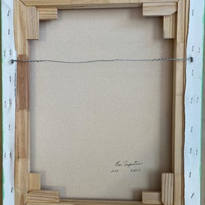 May include: The reverse side of a rectangular canvas painting stretched over a light-coloured wooden frame. The canvas is secured with metal staples along the edges. A thin metal hanging wire is attached to the frame. The artist's signature and 2026 are visible.