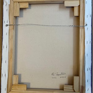 May include: The back of a rectangular canvas painting stretched over a light-colored wooden frame. The canvas is secured with metal staples along the edges. A thin metal hanging wire is attached to the frame. Handwritten text reads 2026 F6305.