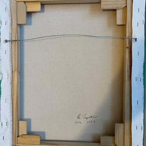 May include: The back of a rectangular canvas painting stretched over a light-colored wooden frame. The canvas is secured with metal staples along the edges. A thin silver wire is attached for hanging. Handwritten text reads 2026 and F0512.
