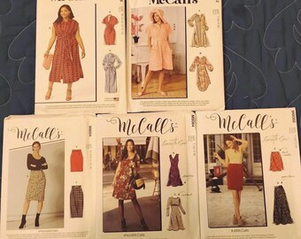 McCall's Misses' patterns:  Three multi-size dress and two skirt. Complete ofuncut