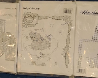 Three Herrschner's  cross stitch projects: Two cat lap quilts; baby crib quilt Tops only
