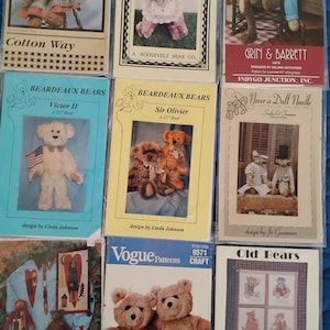 May include: Collection of vintage teddy bear sewing patterns. The patterns feature various bear designs, including bears in outfits, and cross-stitch patterns. The patterns are from different designers and companies.