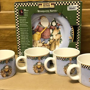 Debbie Mumm four Woodland Santa salad plates and mugs microwave/dishwasher safe ceramic Sakura 4 plate designs mugs match one of the designs