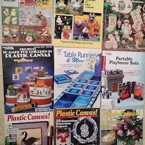 May include: A collection of plastic canvas pattern booklets. Titles include "More Holiday Magnets," "Gimme a Kiss," "It's Christmas," "Projects for Children," "Table Runners," and "Portable Playhouse Sets."