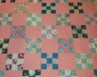 1950s quilt 9 square block alt w. solid orange. 76" x 64" machine pieced and quilted in horizonal rows, borders, Chambray back many fabrics