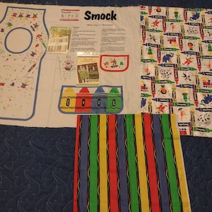 Child art smock panel, Crayola Crayons fabrics: 3.11 yd x 44" squares & 1.25 yds stripes x 45 Binney Smith, coloring bag and quilt patterns