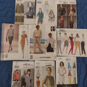 May include: A collection of eight vintage sewing patterns for women's clothing. The patterns are from Vogue and include designs for jackets, blouses, pants, skirts, and dresses. The patterns are in various colors and feature different styles and designs.