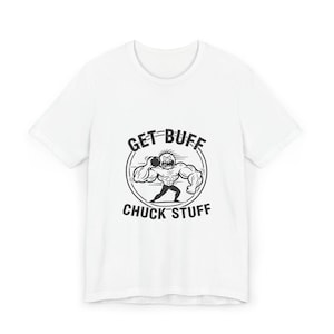 May include: White t-shirt with a black graphic of a muscular cartoon figure throwing a shot put. The text "GET BUFF" is above the figure, and "CHUCK STUFF" is below. The design is enclosed in a circular frame.