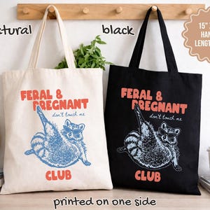 May include: Two tote bags, one natural and one black, each measuring 15 inches by 16 inches with 20-inch handles. Both feature a graphic of a raccoon wearing sunglasses with the text FERAL & PREGNANT CLUB and don't touch me printed on one side.
