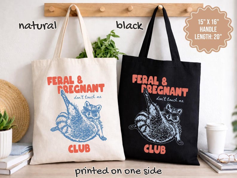 May include: Two tote bags, one natural and one black, each measuring 15 inches by 16 inches with 20-inch handles. Both feature a graphic of a raccoon wearing sunglasses with the text FERAL & PREGNANT CLUB and don't touch me printed on one side.