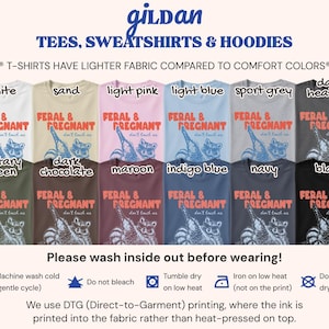 May include: A collection of twelve Gildan t-shirts in various colors including white, sand, light pink, light blue, sport grey, dark heather, military green, dark chocolate, maroon, indigo blue, navy, and black, all featuring a raccoon graphic and the text FERAL & PREGNANT don't touch me.
