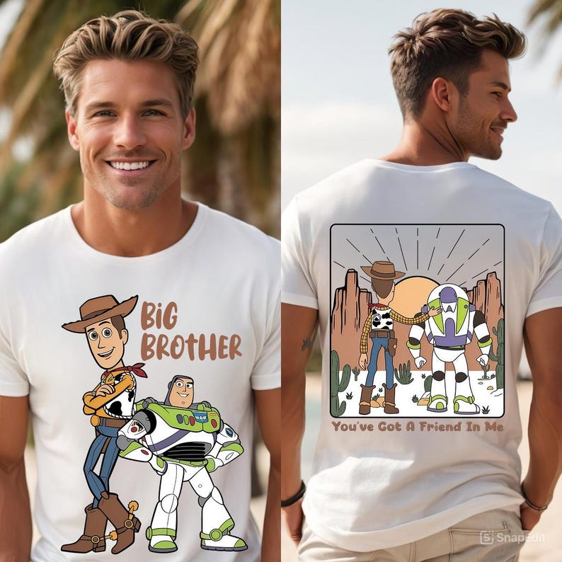 May include: White t-shirt featuring a cartoon illustration of Woody and Buzz Lightyear. The front of the shirt says "Big Brother". The back of the shirt has a desert scene with the text "You've Got A Friend In Me".