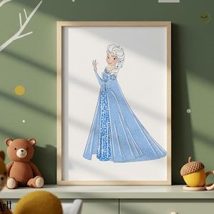 May include: A framed print featuring a cartoon illustration of a character in a blue dress with a long cape. The character has white hair and is posed with one hand raised. The artwork is displayed on a green wall.