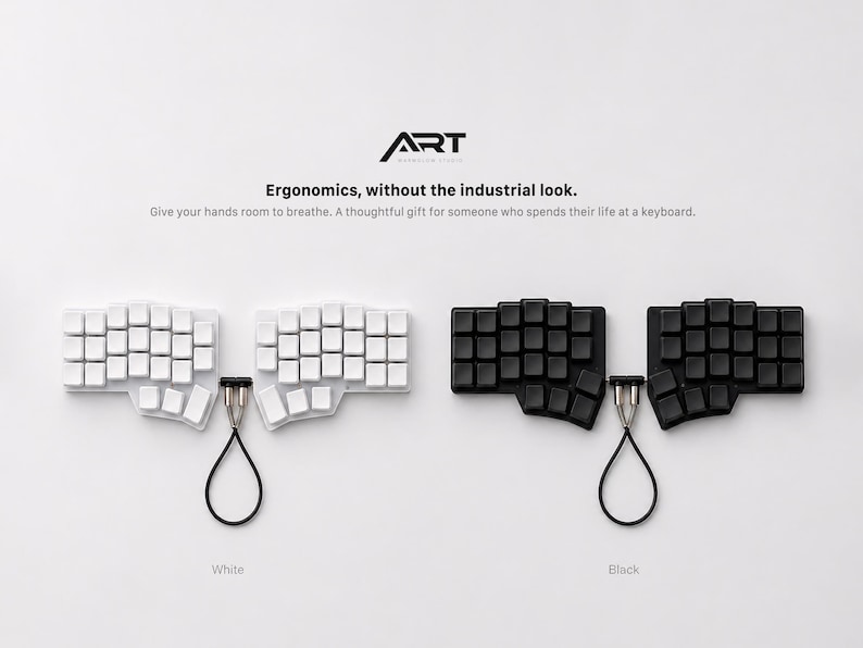 May include: Two split ergonomic keyboards, one white and one black, each featuring a unique key layout and a central connecting cable. The text ART, Ergonomics, without the industrial look. Give your hands room to breathe. A thoughtful gift for someone who spends their life at a keyboard. is visible above the keyboards.
