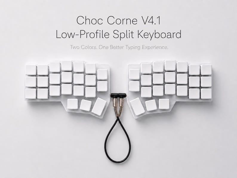 May include: A Choc Corne V4.1 low-profile split keyboard with white keycaps on a clear base. The two halves are connected by a black TRRS cable with metallic connectors. The text reads: Choc Corne V4.1 Low-Profile Split Keyboard. Two Colors. One Better Typing Experience.