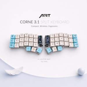 May include: A split keyboard with white and light blue keycaps, labelled "CORNE 3.1 SPLIT KEYBOARD." The keyboard is compact, wireless, and ergonomic. The image includes the text "A Lighter Way to Type."