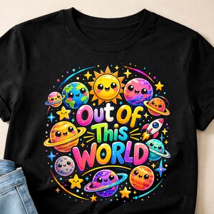 May include: Black t-shirt featuring a colorful graphic of planets, stars, and a smiling sun. The text "Out of This World" is prominently displayed. The design includes a rocket ship and various celestial bodies.