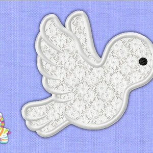 May include: White lace applique of a dove with a yellow beak and black eye. The dove is flying with its wings spread out. The applique is on a light blue background.