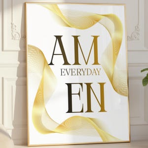 Könnte beinhalten: Gerahmter Kunstdruck mit den Worten "AM EVERYDAY EN" in Schwarz und Gold. Der weiße Hintergrund zeigt fließende goldene Linien. Das Kunstwerk ist in einem goldenen Rahmen eingefasst.