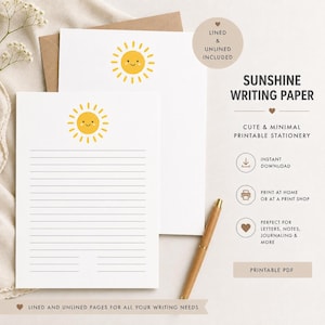 May include: Two sheets of white writing paper featuring a yellow sun illustration with a smiling face. One sheet is lined, and the other is unlined. A wooden pen rests beside the paper. Text includes SUNSHINE WRITING PAPER, LINED & UNLINED INCLUDED.