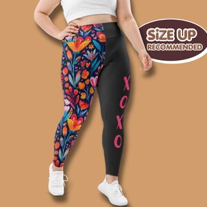 May include: Leggings with a floral and black design. One leg has a vibrant floral pattern with orange, blue, and pink flowers. The other leg is plain black with pink "XOXO" text. The image includes the text "Size Up Recommended".