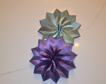 Estrella antiestrés con asa. Juguete sensorial de escritorio. Efectos visuales y sonoros hipnóticos.