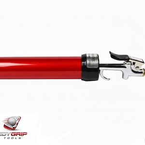 May include: A red Speedy Grip Tools air gun with a black handle and silver nozzle. The air gun is on a white background. The model number is SG-2.