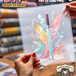 May include: A clear DTF (Direct to Film) transfer sheet featuring a colorful illustration of a sword and feathers. The text "DTF READY TO PRESS" is visible. Instructions indicate a temperature range of 300-310F for 8-10 seconds, with hot or cold peel options.