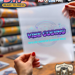 May include: A white ceramic mug with a black handle and the text "But First, Coffee" in a bold, black font. The mug is set against a blurred background, suggesting a cozy setting.