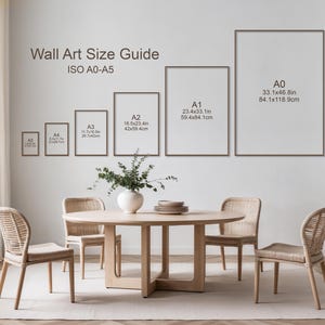 May include: A dining room scene with a round wooden table and four woven chairs. The wall displays a wall art size guide, with framed examples from A5 to A0 sizes, including measurements in inches and cm.