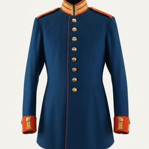 May include: A navy blue military-style jacket with gold buttons and trim. The jacket features a high collar with gold and orange stripes, orange shoulder epaulets, and orange cuffs. The jacket is a long-sleeved garment.