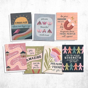 May include: Set of ten greeting cards with inspirational messages and colorful illustrations. The cards feature a variety of designs, including butterflies, flowers, houses, and people. The messages include "Embrace these new beginnings", "You are beautiful inside and out", "Be your awesome self", "No matter the outcome, you are on the right path", "You are amazing just the way you are", "So freaking proud of you", and "See the unique strength in each person you meet".