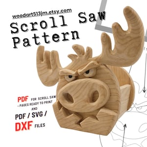 May include: A wooden scroll saw pattern for a moose-shaped box. The moose has an angry expression with large antlers and a prominent nose. The text "Scroll Saw Pattern" and the Etsy shop URL are visible.
