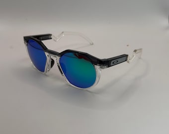 O HSTN Sunglasses – Clear Frame with Blue   Lenses  • Oakley Houston • Round Retro Lenses • Zigzag Temple Arms