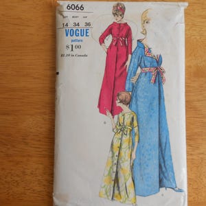 May include: A Vogue pattern envelope numbered 6066, size 14, bust 34, hip 36. The illustration displays three floor-length robes: one solid pink with a front tie, one blue with a floral collar and waist tie, and one yellow with a floral pattern.