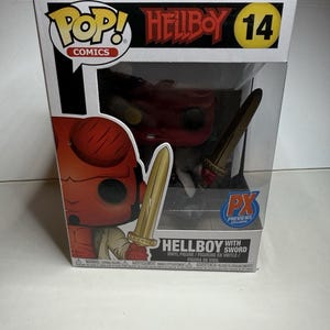 May include: A Hellboy vinyl figure with a sword, packaged in a box. The box features the Pop! Comics logo, the Hellboy title, and the number 14. The figure is red with a tan trench coat.