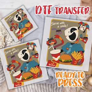 May include: DTF transfer featuring a cartoon character with a large white face, blue shirt, and a red and orange striped arm. The design includes a burger, fries, and a drink. Text reads "Serve with a smile!" and "Ready to Press."