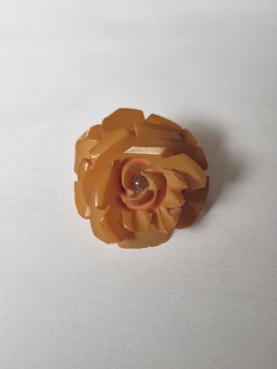 Vintage butterscotch celluloid rosebud brooch