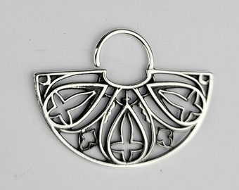 May include: A silver-toned, openwork earring with a half-circle design. The earring features a decorative pattern of stylized floral and cross-like shapes. A small, circular clasp is at the top for securing the earring.